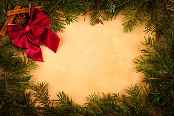 Claret bow on old paper, Christmas decoration — Stock Photo, Image