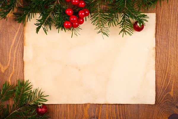 Rustic paper with Christmas decorations — Stock Photo, Image