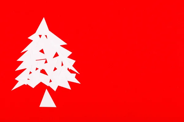 Paper Christmas tree on red — Stock Photo, Image