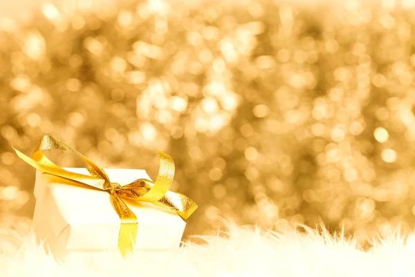 Small giftbox with golden ribbon — Stock Photo, Image
