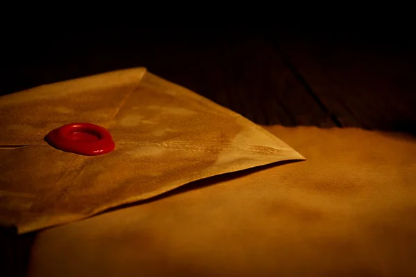 Closeup view of old envelope with wax seal stamp — Stock Photo, Image