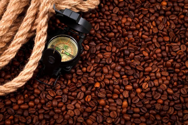 Coffee beans with compass — Stock Photo, Image