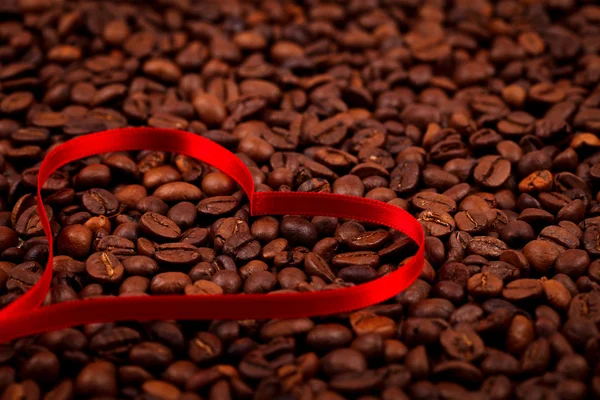 Coffe beans with ribbon heart — Stock Photo, Image