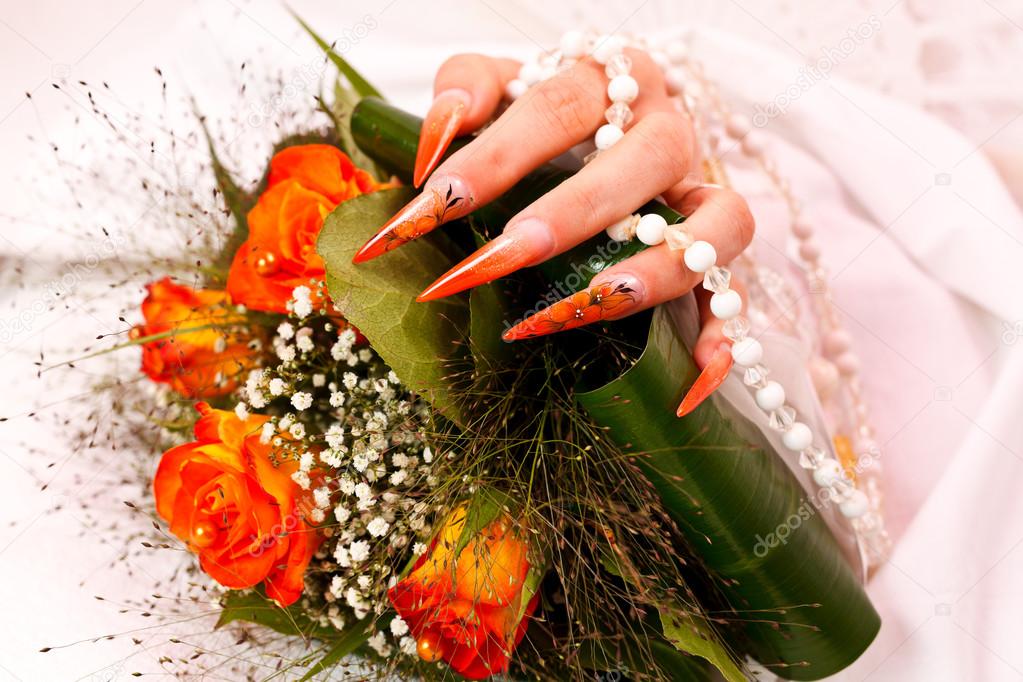 Long orange artificial bridal nails