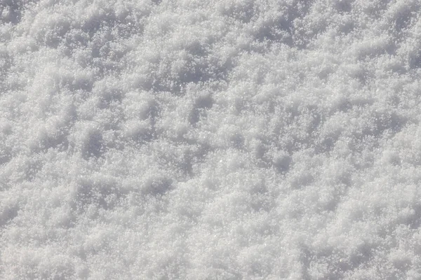 雪の地面と美しい冬の背景 自然な雪のテクスチャ 雪の表面に風の彫刻パターン — ストック写真