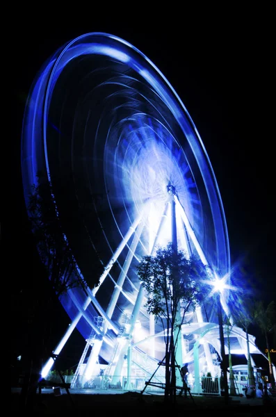 Ferris wheel in motion in a night time — Stock Photo, Image