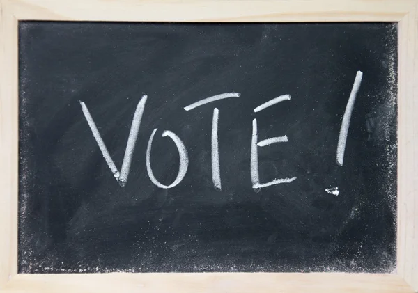 Vote title written with chalk on blackboard — Stock Photo, Image