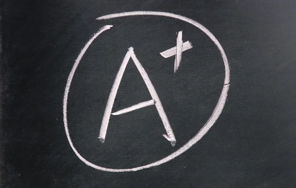 A plus sign drawn with chalk on blackboard — Stock Photo, Image