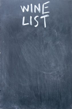 wine list title written with chalk on blackboard clipart