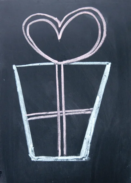 Gift box drawn with chalk on blackboard — Stock Photo, Image