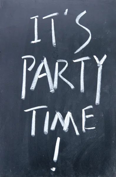 It is party time written with chalk on blackboard — Stock Photo, Image