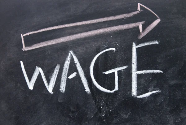 Increase wage sign drawn with chalk on blackboard — Stock Photo, Image