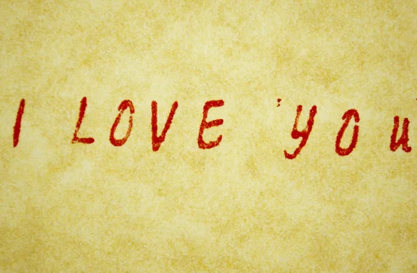 kalemle parşömen üzerine yazılmış başlık seviyorum