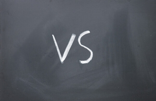 vs sign written with chalk on blackboard