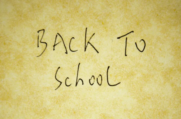 Back to school written with pen on parchment — Stock Photo, Image