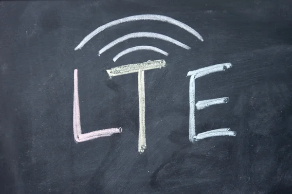 Lte sign drawn with chalk on blackboard — Stock Photo, Image