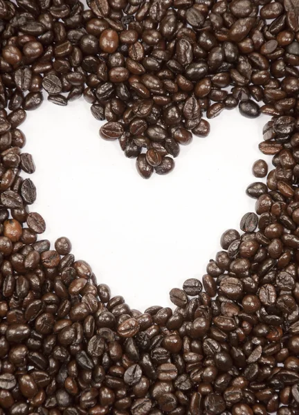 Kávová zrna a srdce znamení — Stock fotografie