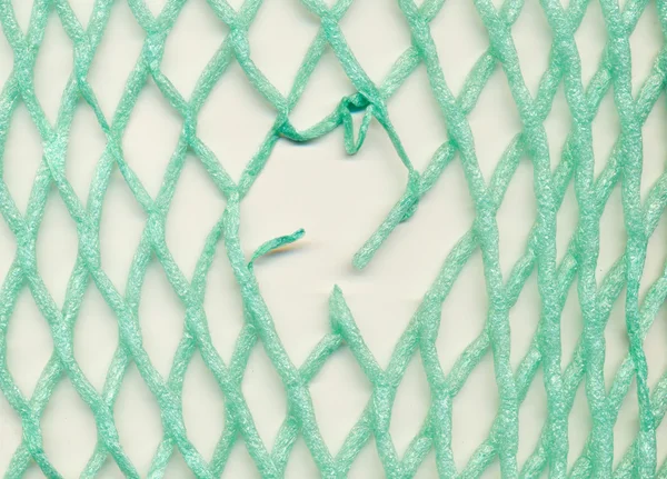 Damaged plastic mesh — Stock Photo, Image