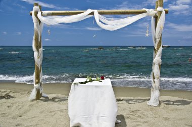 setting for wedding on the beach of citara on the island of Isch clipart