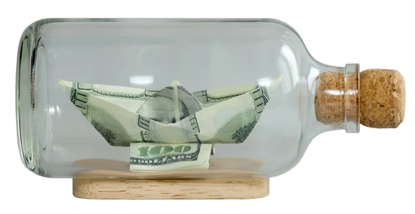 The boat made ​​of dollars in a bottle capped — Stock Photo, Image