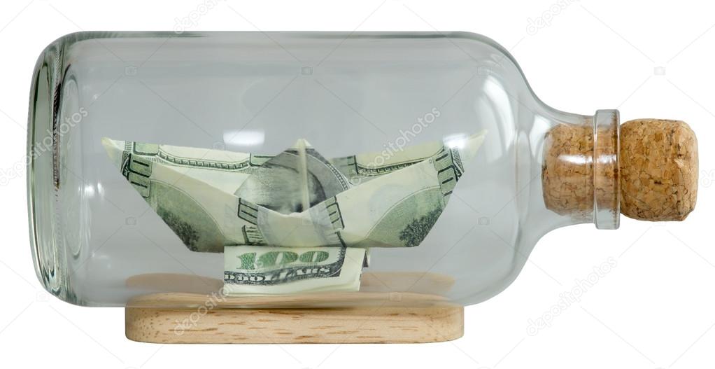 The boat made ​​of dollars in a bottle capped