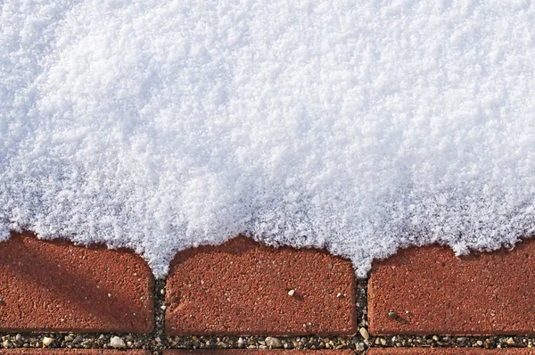Neve con pavimento rosso — Foto Stock