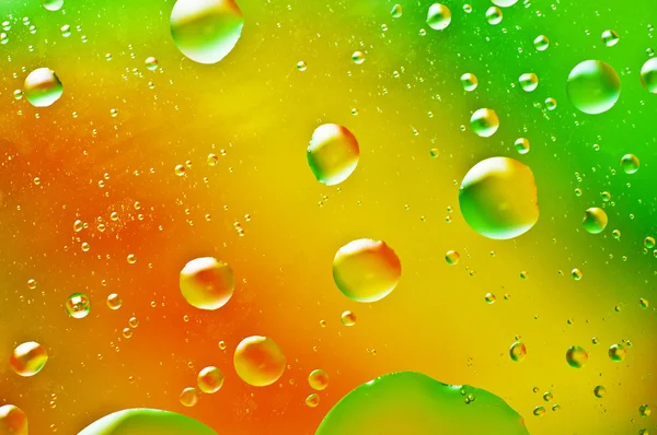 Oil-drops floating in water — Stock Photo, Image