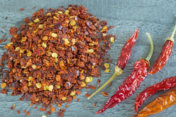 Chili powder and fruits — Stock Photo, Image