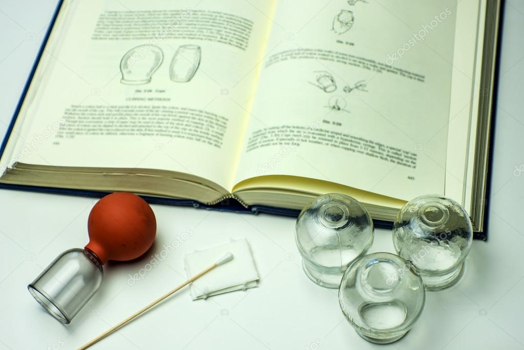 Cupping glasses with textbook