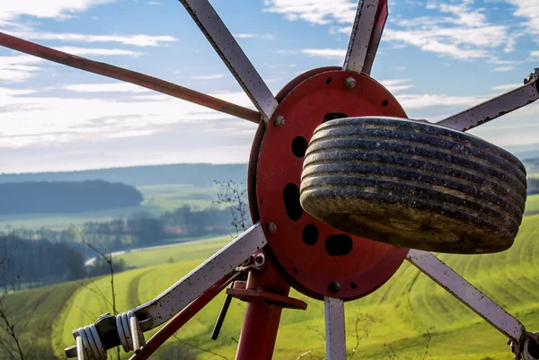 Panoramic view through a hay turning machine — Stock Photo, Image