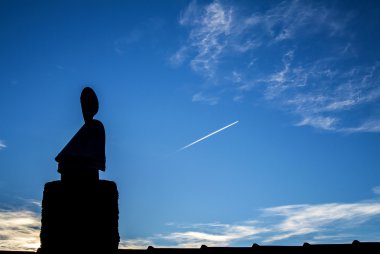 Buddha on a roof clipart