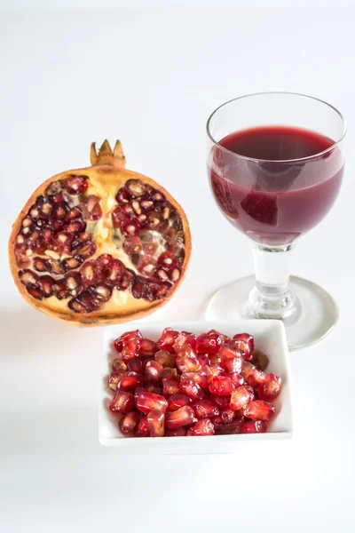 Pomegranate, fruit, seeds and juice — Stock Photo, Image