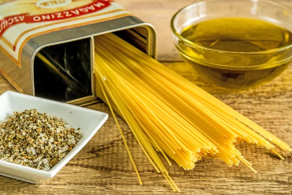 Italian food, olive oil , noodles and herbal salt — Stock Photo, Image