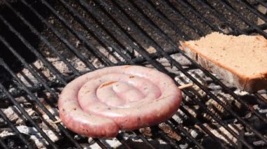 barbecue with German Bratwurst on charcoal