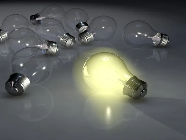 Lit light bulb among unlit ones — Stock Photo, Image