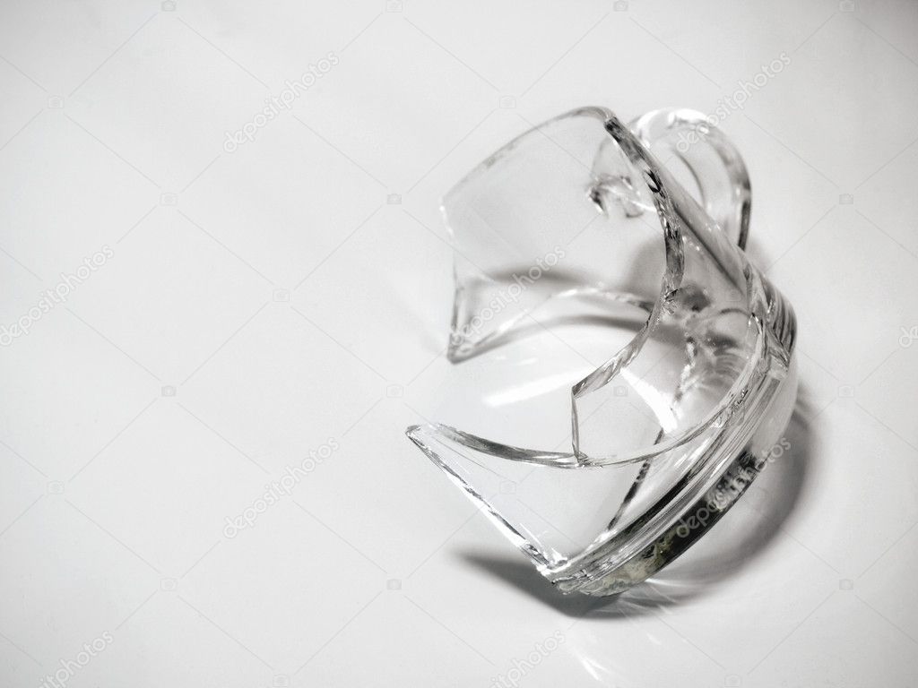 Black and white broken glass against grey background, concept of recycling.