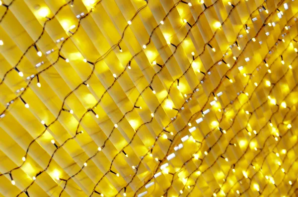 Textura lâmpadas amarelas guirlandas — Fotografia de Stock