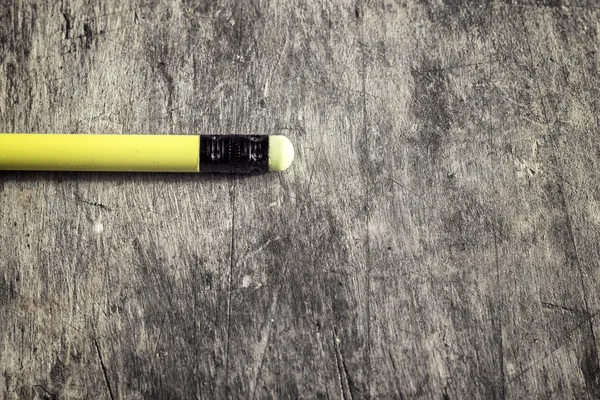 Classic graphite pencil lying on a table — Stock Photo, Image