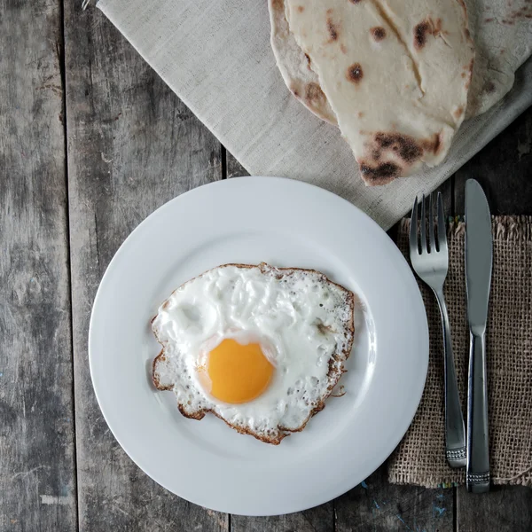 Fried Eggs with bread in plate — Stock Photo, Image