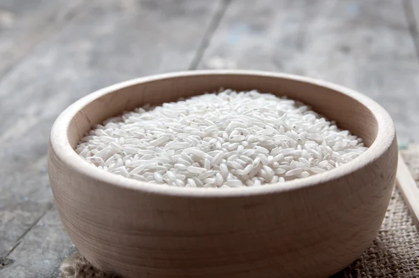 Rice in wooden bowl — Stock Photo, Image