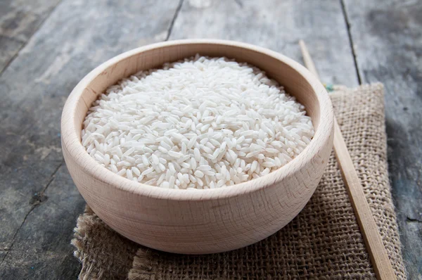 Rice in wooden bowl — Stock Photo, Image