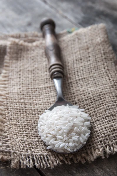 Rice in spoon — Stock Photo, Image