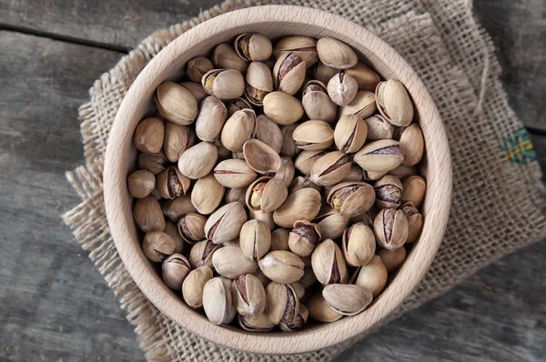 Dried Pistachio Nuts In A Wooden Bowl — Stock Photo, Image