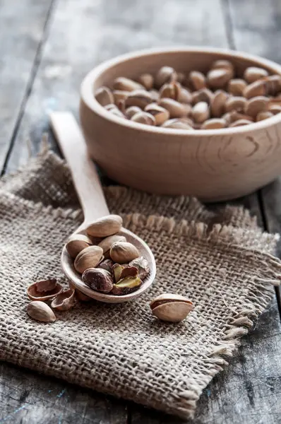 Dried Pistachio Nuts In A Wooden Bowl — Stock Photo, Image