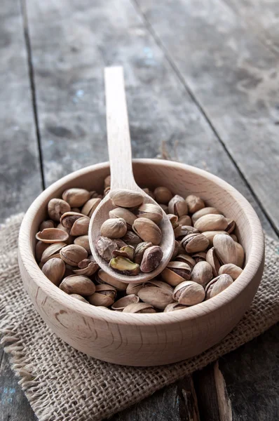 Dried Pistachio Nuts In A Wooden spoon — Stock Photo, Image