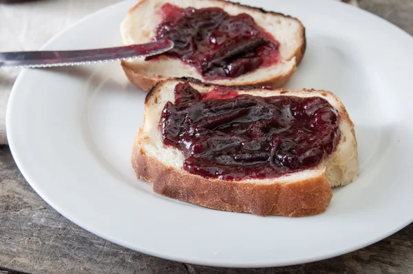 Plum jam with bread — Stock Photo, Image