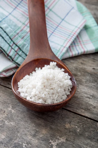 Sea salt in a wooden spoon — Stock Photo, Image