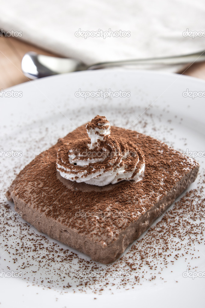 chocolate mousse portion  in white plate