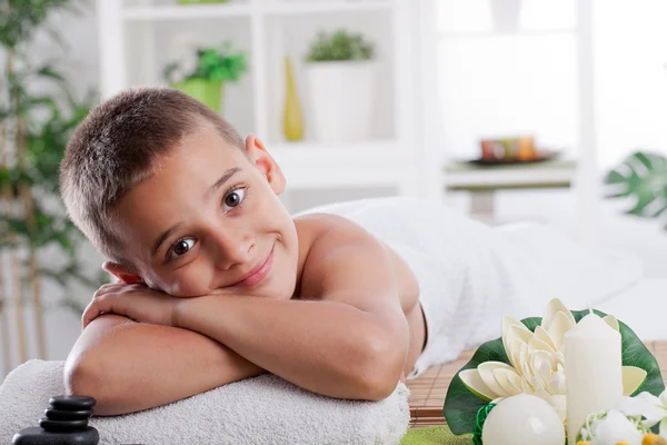 Young smiling boy in spa salon — Stock Photo, Image