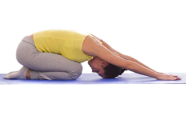 Young woman exercise on a mat — Stock Photo, Image